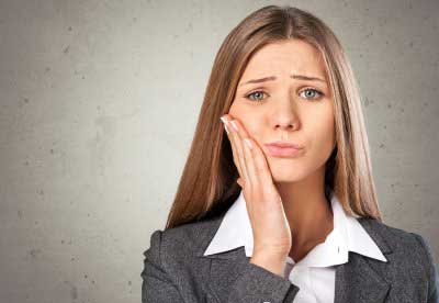 Woman having tooth pain