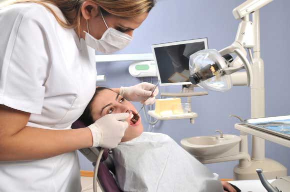 Dentist checking a patient