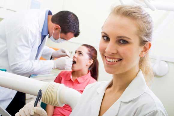 Dentist checking a lady patient