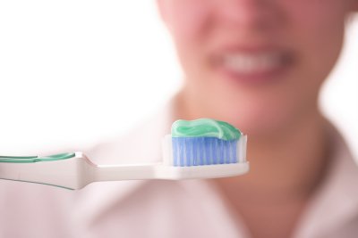 Woman holding toothbrush