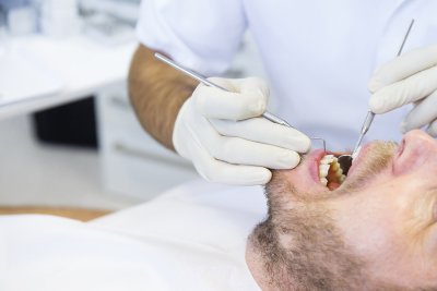 Dentist checking the patient's teeth