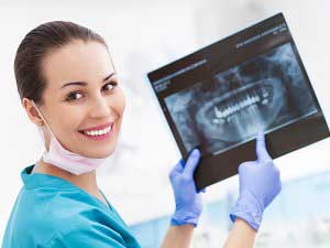 Dentist showing a teeth x-ray