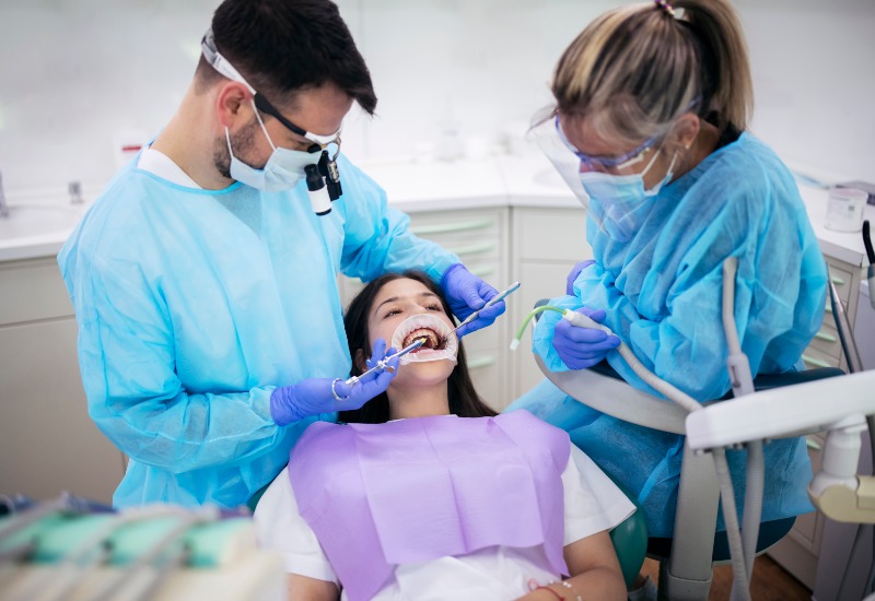 Dentist performing dental bridge in Westlake, OH