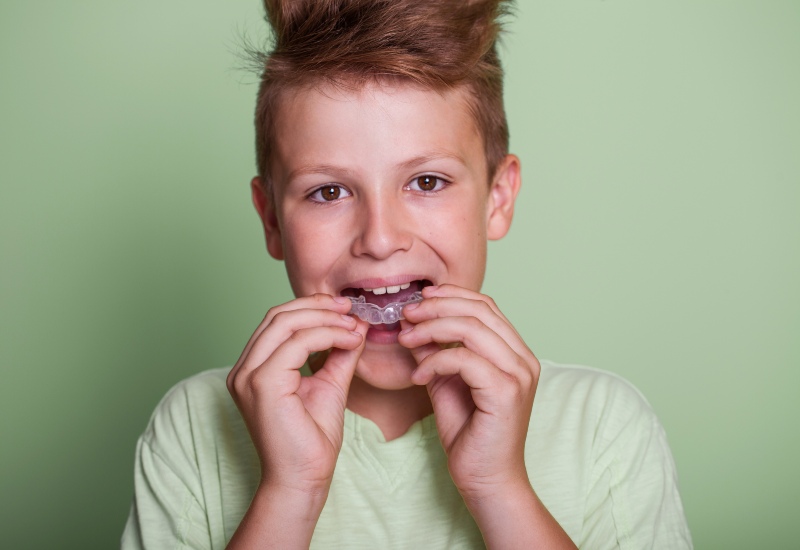Child using the dental mouthguard in Westlake, OH