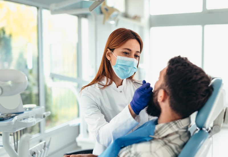 A dentist performing Temporomandibular Joint Disorders treatment in Westlake, OH