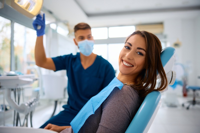 Patient consults with dentist after orthodontic treatment in Westlake, OH