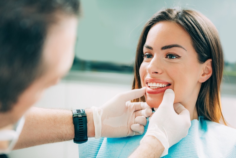 Patient receiving cosmetic gum contouring consult at dental clinic in Westlake, OH